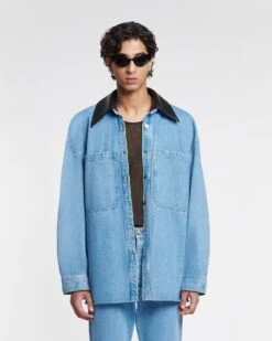 Nanushka Beaux - Leather-Trimmed Denim Shirt - Mid Blue 15 Nanushka Beaux - Leather-Trimmed Denim Shirt - Mid Blue -Nanushka Fashion Store NU24PFJK00553 BEAUX MID BLUE BLACK DENIM REGEN LEATHER 3
