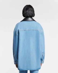 Nanushka Beaux - Leather-Trimmed Denim Shirt - Mid Blue 16 Nanushka Beaux - Leather-Trimmed Denim Shirt - Mid Blue -Nanushka Fashion Store NU24PFJK00553 BEAUX MID BLUE BLACK DENIM REGEN LEATHER 4 1